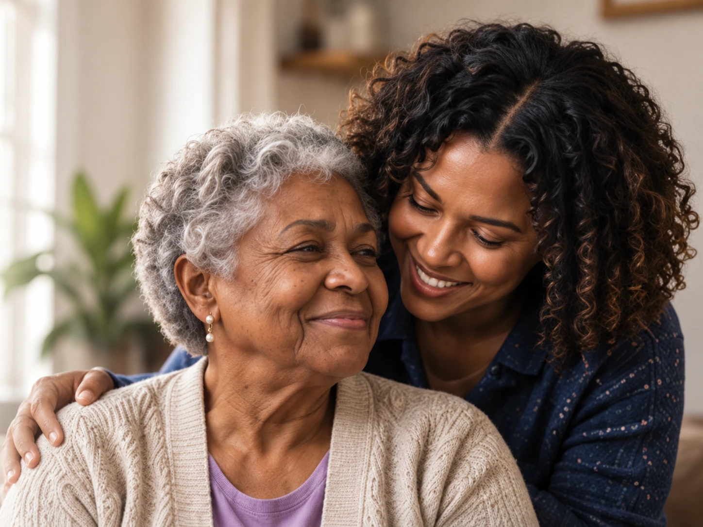 An adult daughter and her older mother sharing an affectionate moment at home